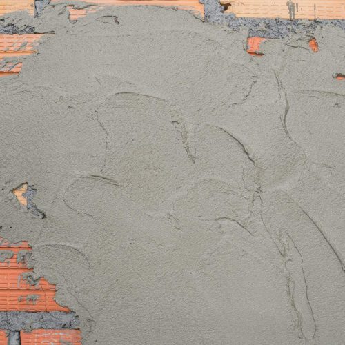 Cement plastering on brickwork background