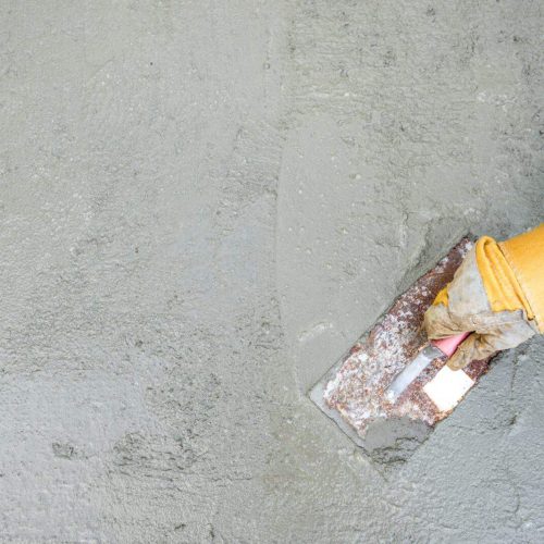 Workman or builder doing plastering